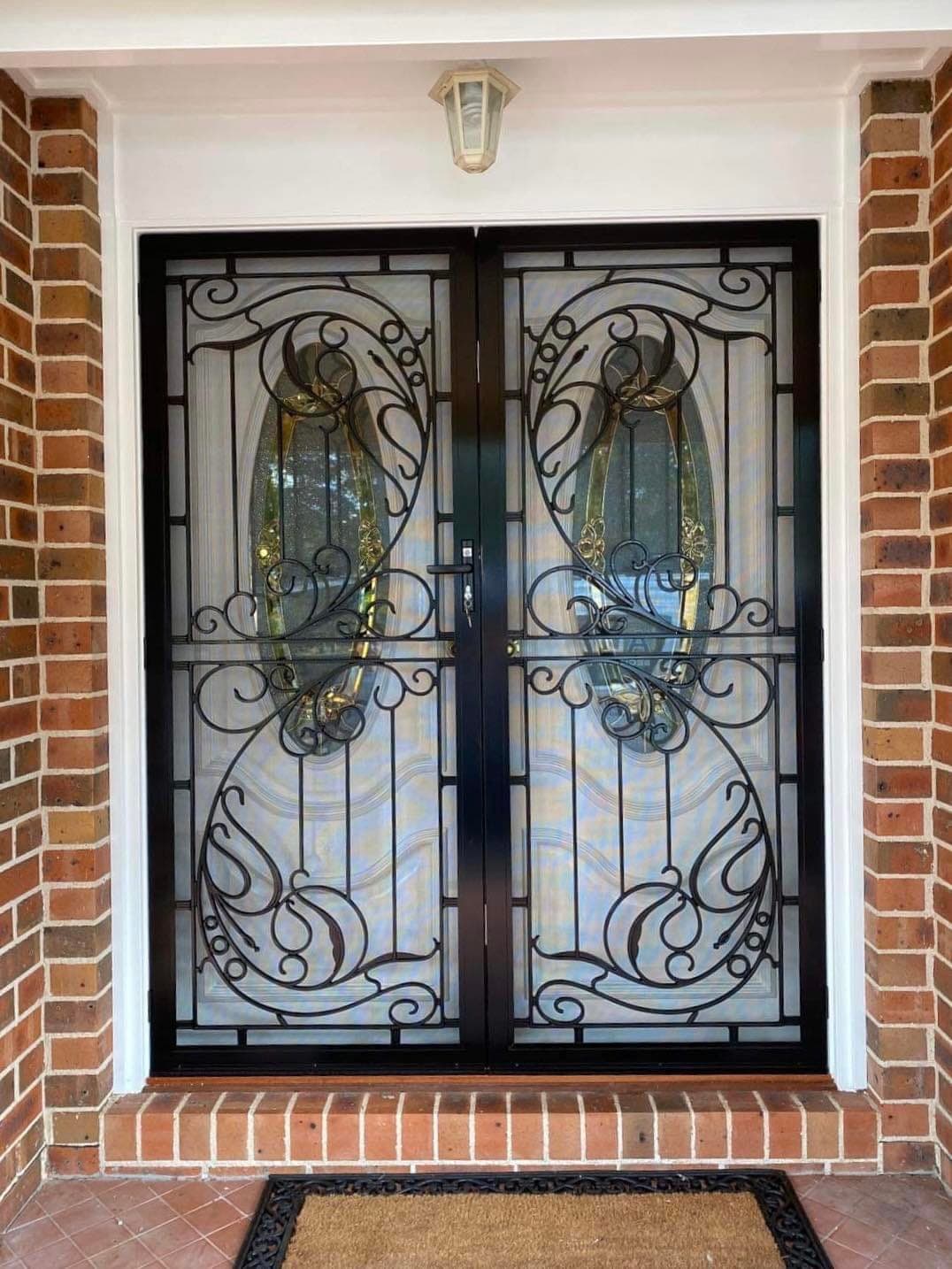 Heritage decorative screen door installed by Advanced Security Doors
