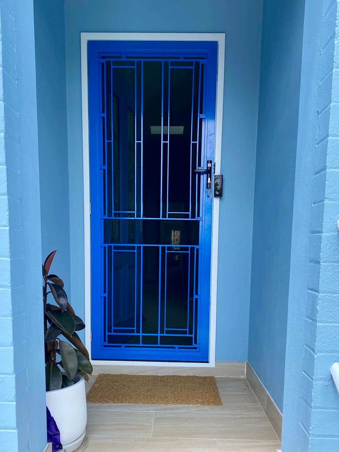 Heritage decorative screen door installed by Advanced Security Doors