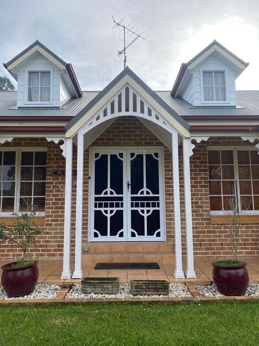 Heritage decorative screen door installed by Advanced Security Doors