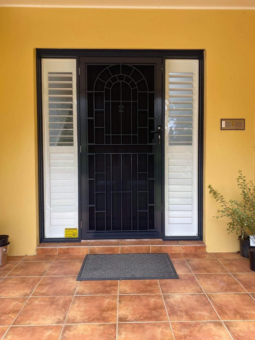Heritage decorative screen door installed by Advanced Security Doors