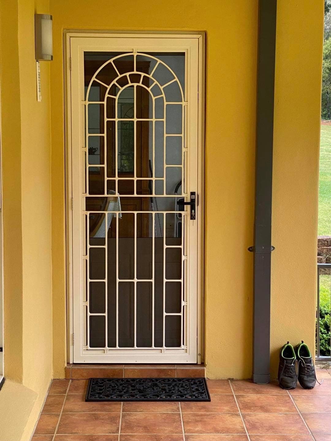 Heritage decorative screen door installed by Advanced Security Doors
