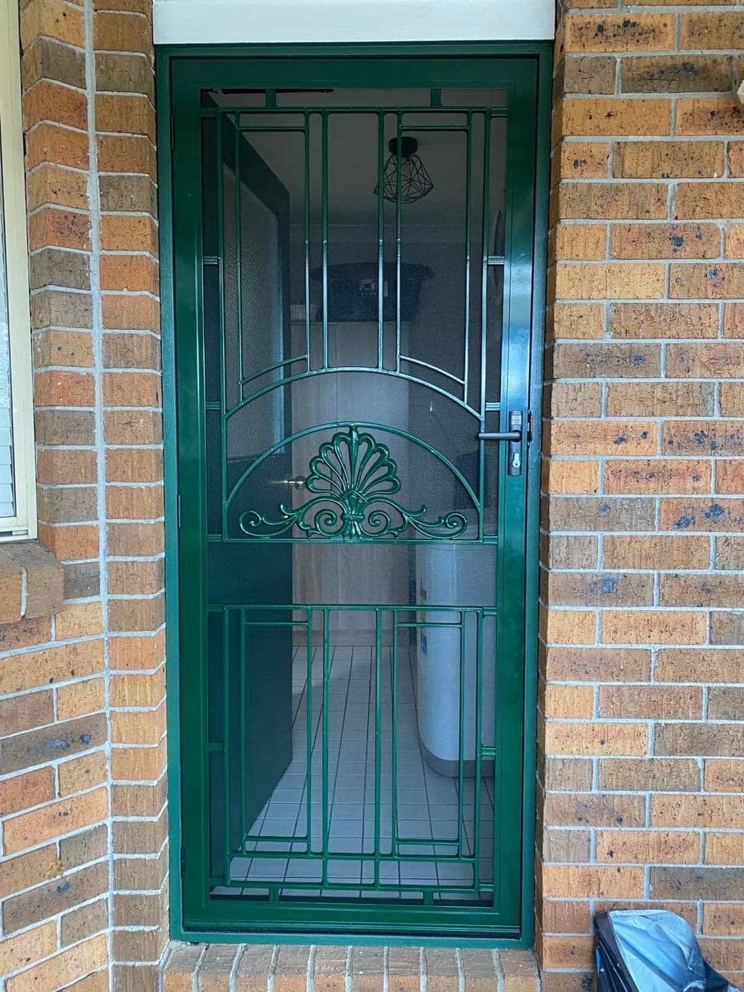 Heritage decorative screen door installed by Advanced Security Doors