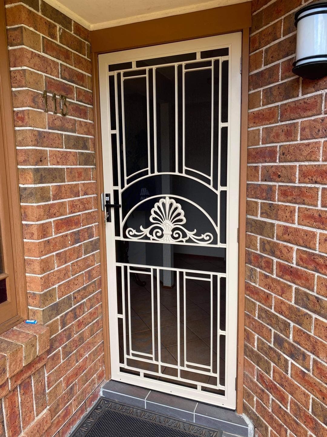 Heritage decorative screen door installed by Advanced Security Doors