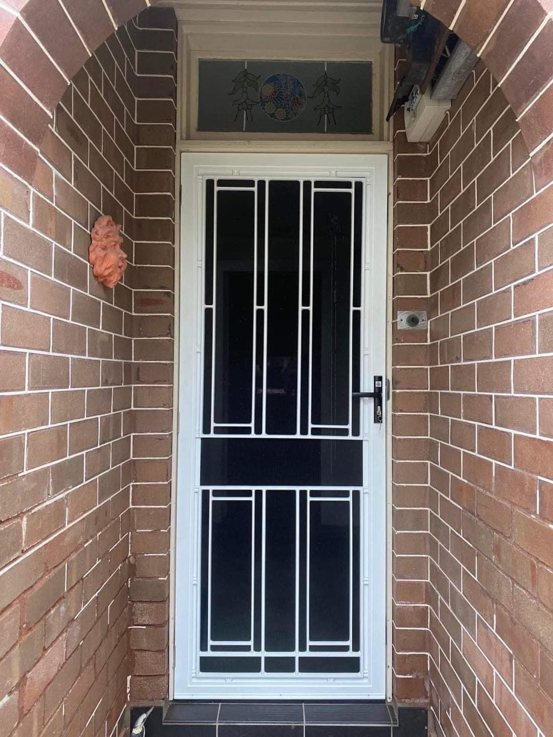 Heritage decorative screen door installed by Advanced Security Doors
