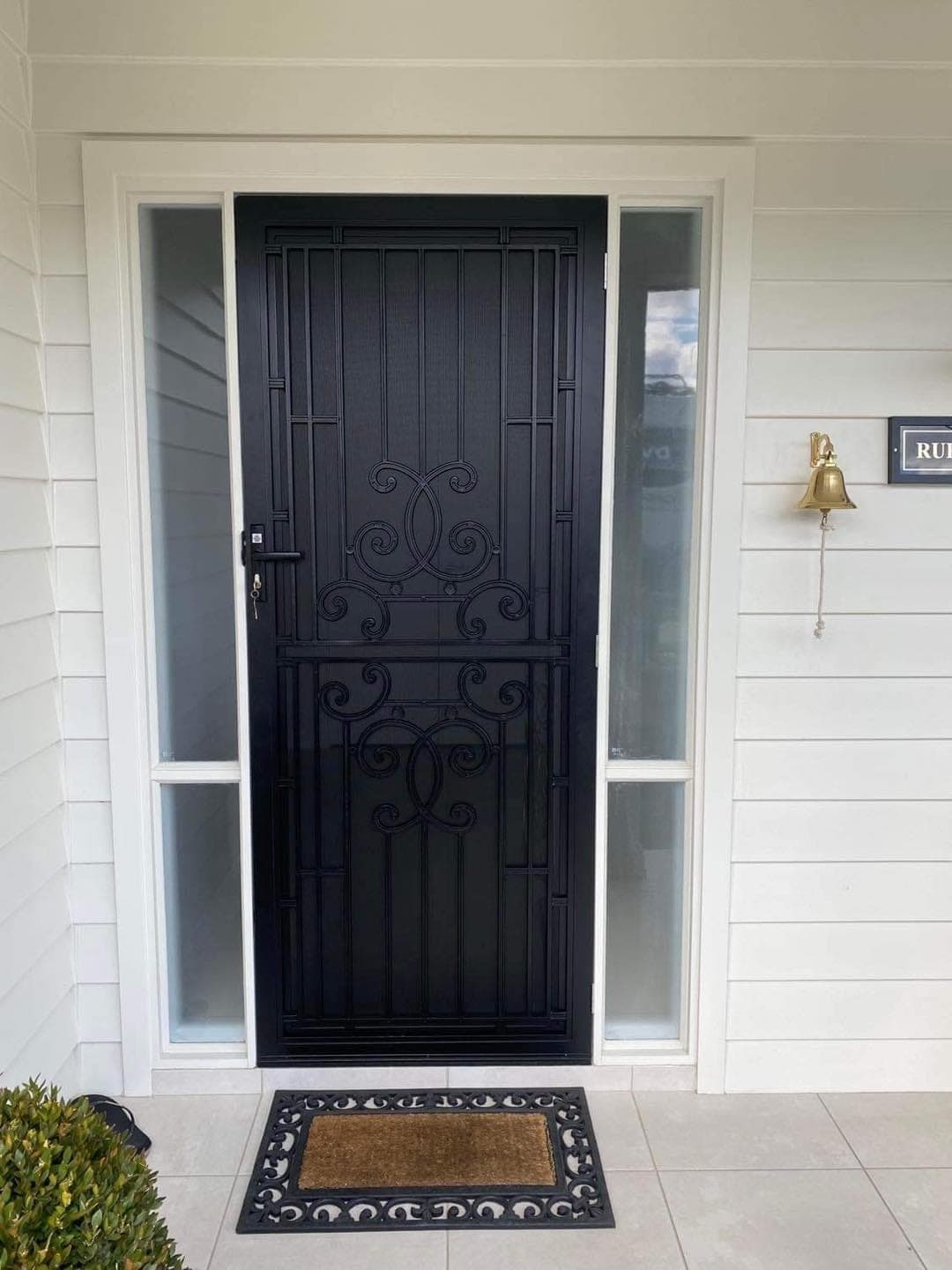 Heritage decorative screen door installed by Advanced Security Doors