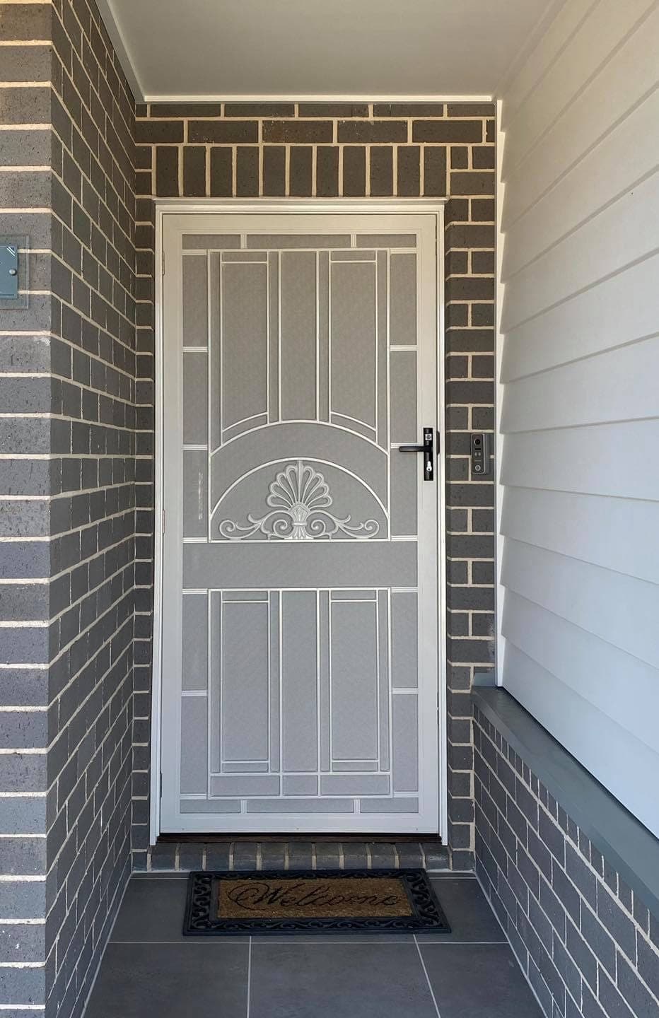 Heritage decorative screen door installed by Advanced Security Doors